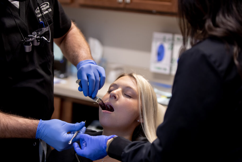 Dr Charles Abraham working on a patients mouth