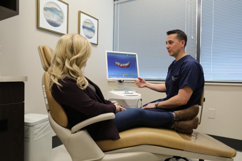 Oral Surgeon working with patient